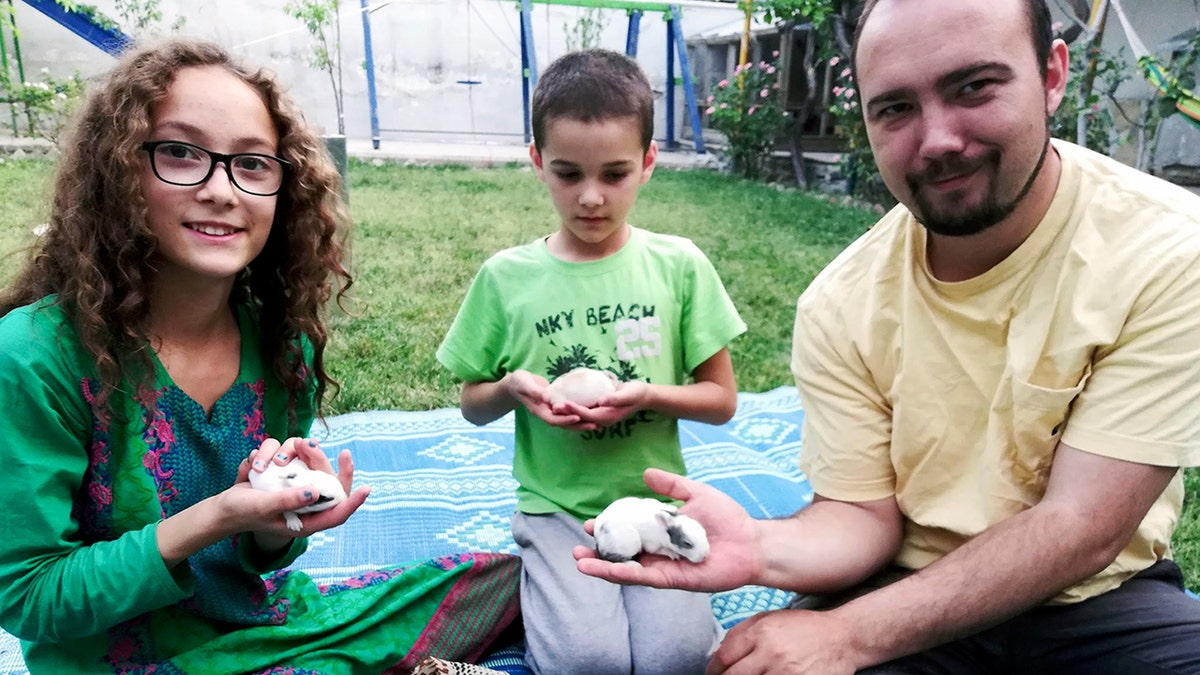 Ryan Corbett and two of his children