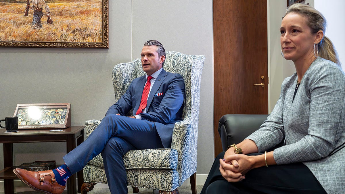 Pete Hegseth, President-elect Donald Trump's nominee to be defense secretary, left, joined by his wife Jennifer Hegseth, attends a meeting with Sen. Mike Rounds, R-S.D., a member of the Senate Armed Services Committee, at the Capitol in Washington, Thursday, Dec. 5, 2024. (AP Photo/J. Scott Applewhite)