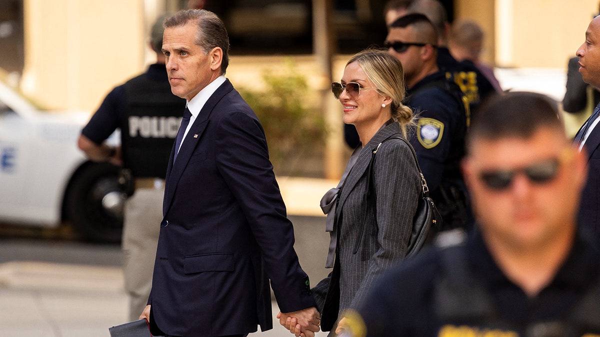 Hunter Biden and Melissa Cohen Biden leaving court