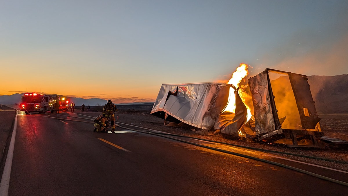 firefighters extinguishing truck fire