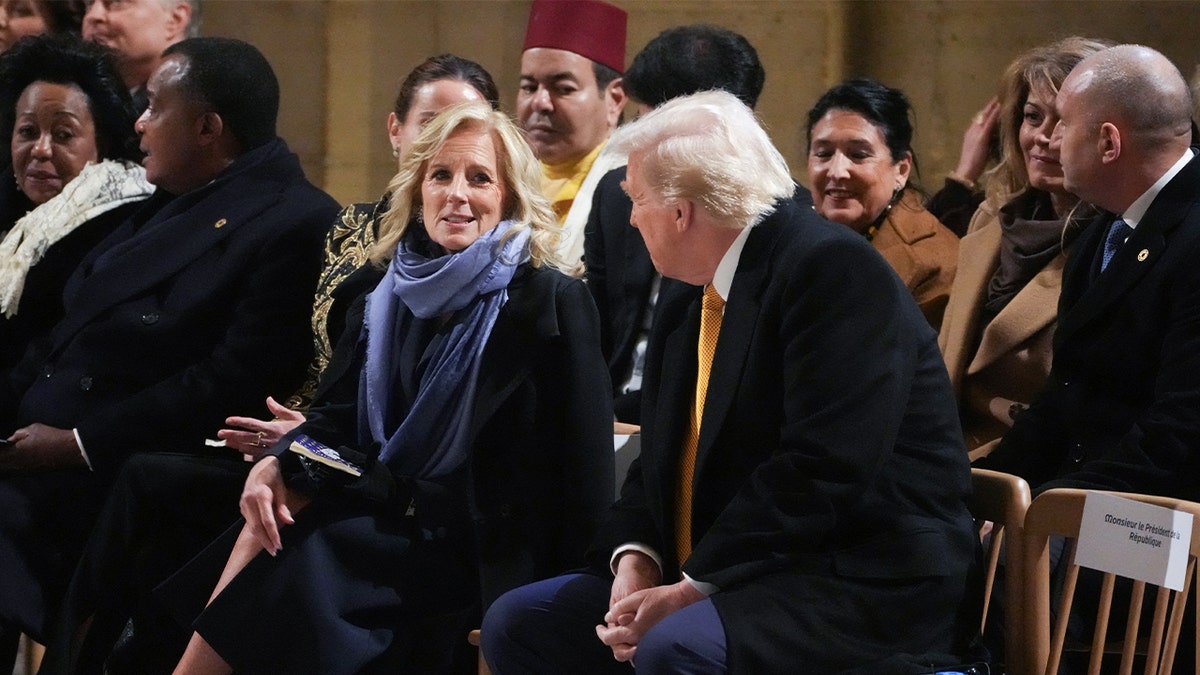 First lady Jill Biden speaks with President-elect Donald Trump during a ceremony to mark the reopening of Notre Dame Cathedral in Paris on Dec. 7, 2024.