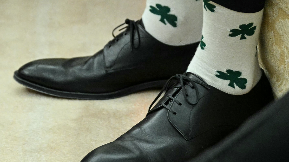 Vice President JD Vance wears socks with shamrocks during a meeting with President Donald Trump and Irish Prime Minister Micheal Martin in the Oval Office of the White House in Washington, D.C., on March 12, 2025.