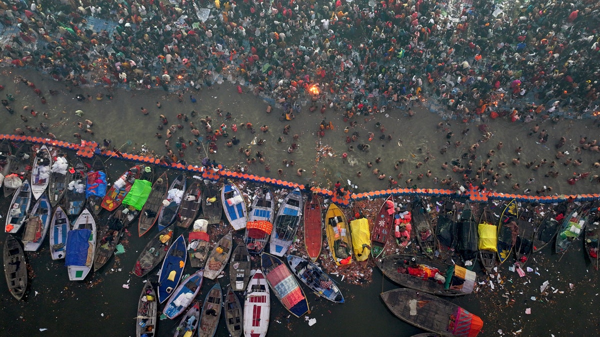 Hindu devotees gather at a holy site where a stampede occurred during the Maha Kumbh festival in Prayagraj, India, on Jan. 29, 2025.