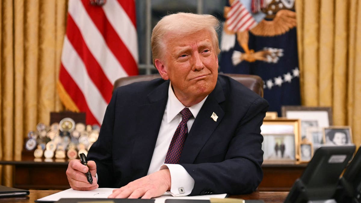 Trump at desk in Oval Office closeup shot