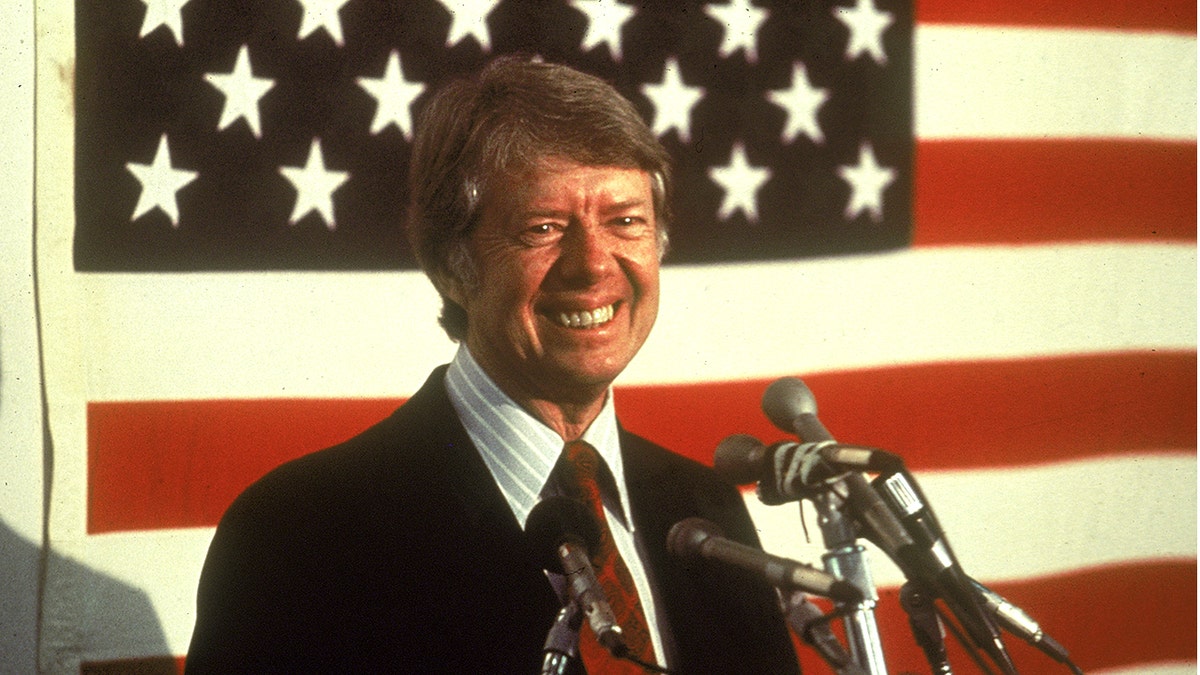 Jimmy Carter in front of an American flag