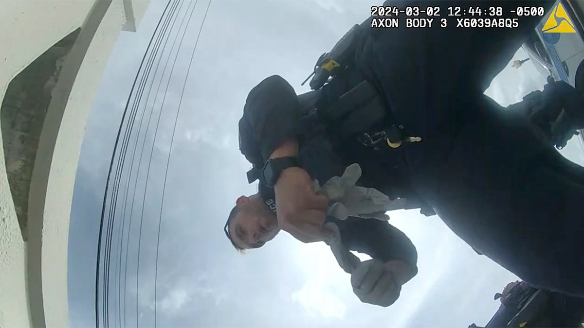 Body cam footage police officers tending to Fabio Balanos’ injuries after being shot in the leg on the Venetian Causeway