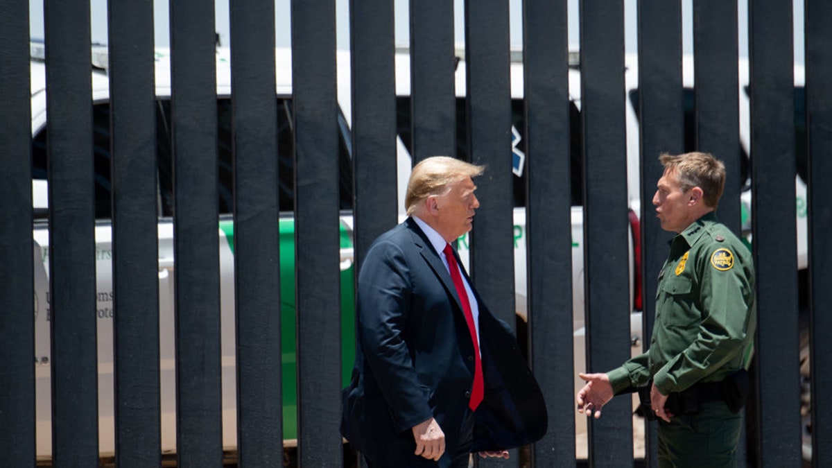 Trump talking to Border Patrol chief at border wall