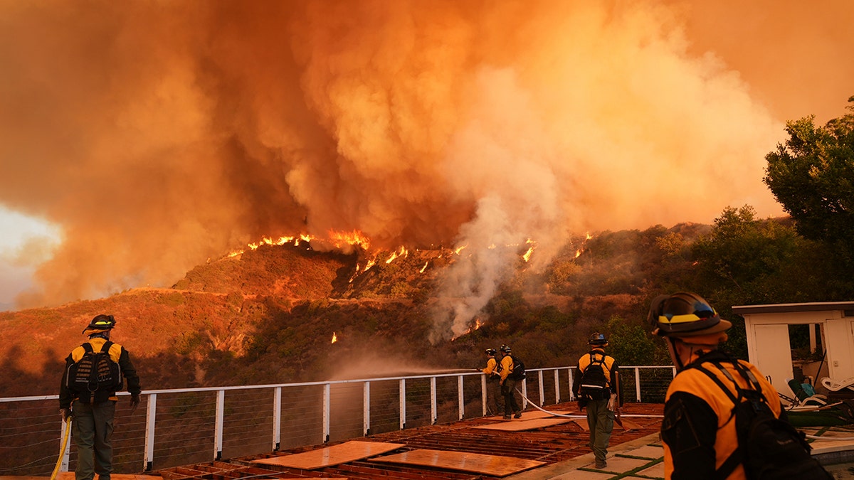 Fire crews monitor the Palisades Fire