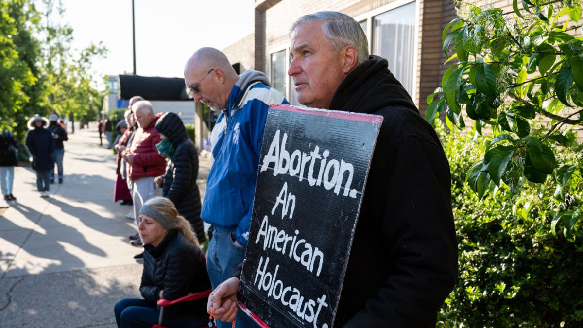 Pro-life protesters demonstrate outside an abortion clinic