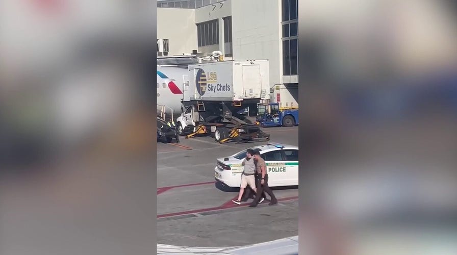 Florida couple arrested after trying to force their way onto American Airlines plane