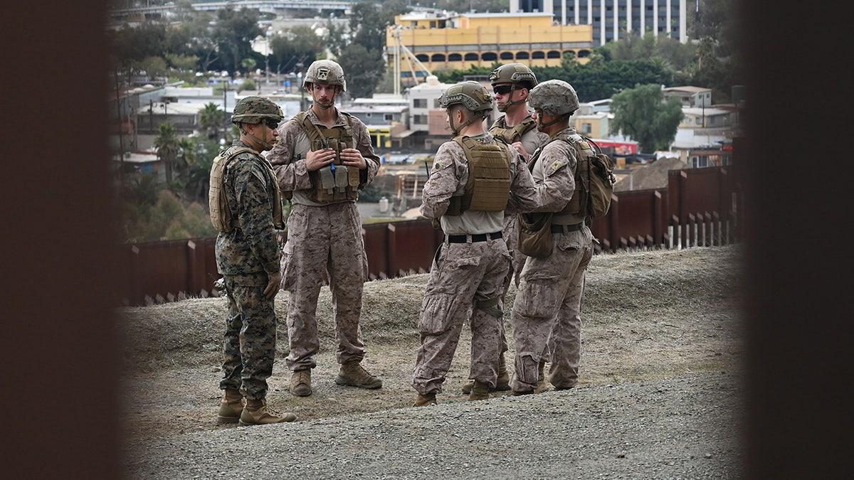 United States Marine Corps troops patrol the US-Mexico border