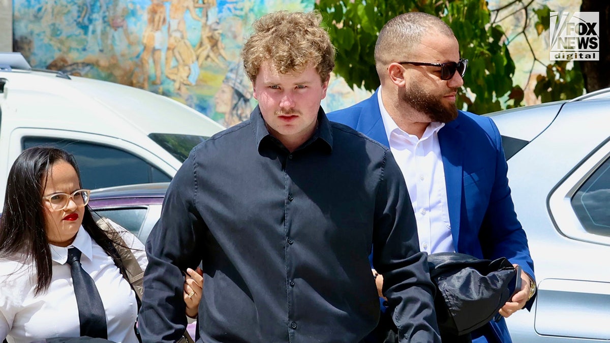 Joshua Riibe arrives at the courthouse in the Dominican Republic