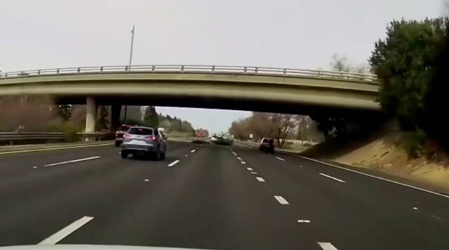 Dash cam video shows car flying off California highway overpass