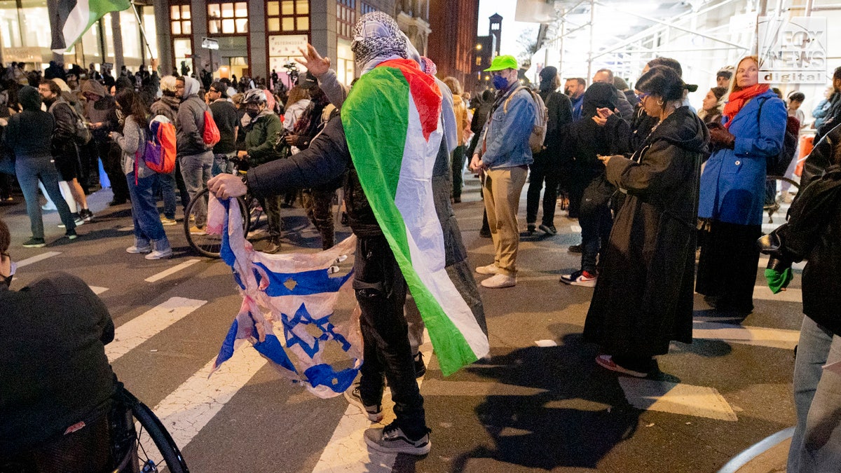 Hundreds of anti-Israel agitators stage a demonstration outside of NYU’s Stern School of Business in Manhattan