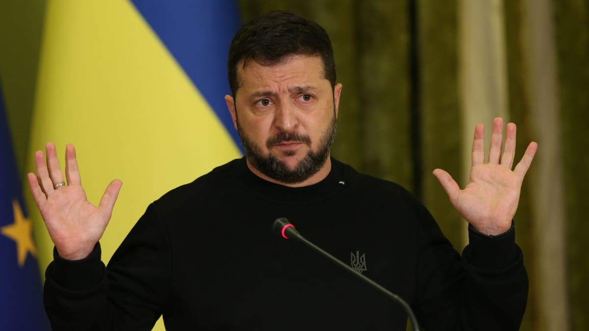 Ukraine President Zelenskyy pictured in front of Ukraine flag 