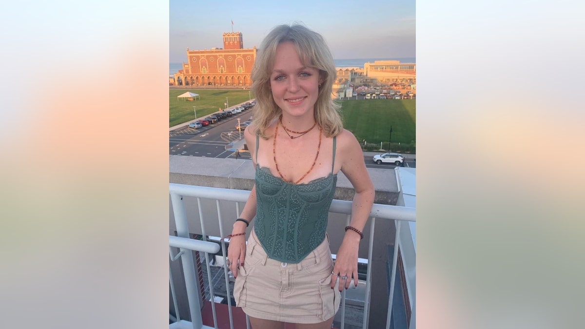 Julia Ludwig poses on a balcony