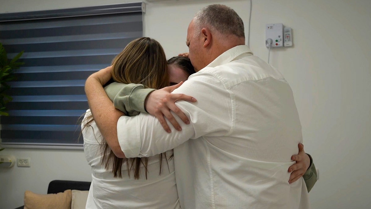 Former Hamas hostage Agam Berger is reunited with her family.