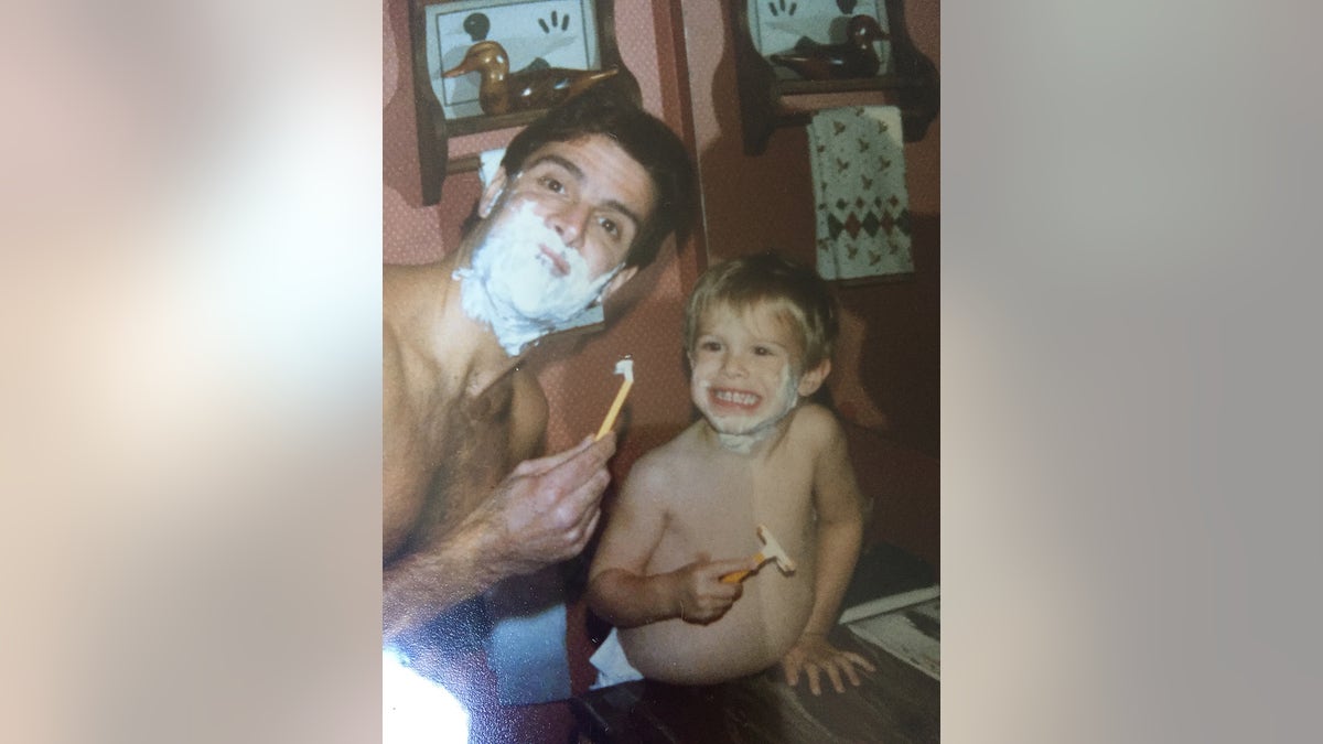 Ken Tekiela shaving with his son Kyle.