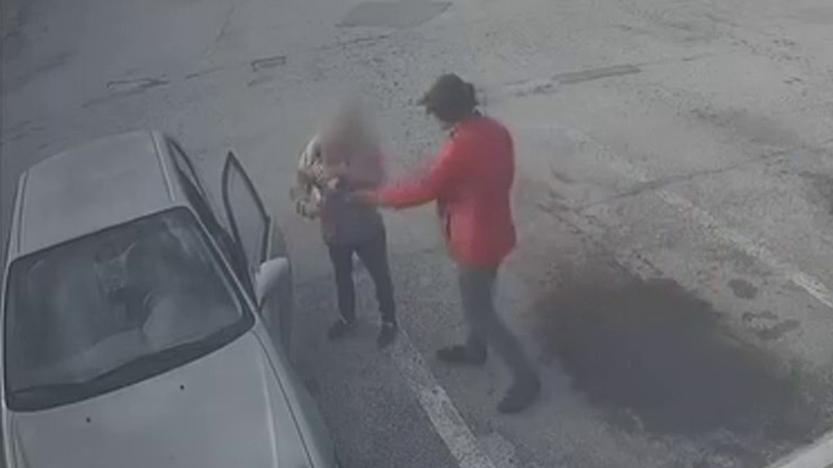 Suspect approaches woman