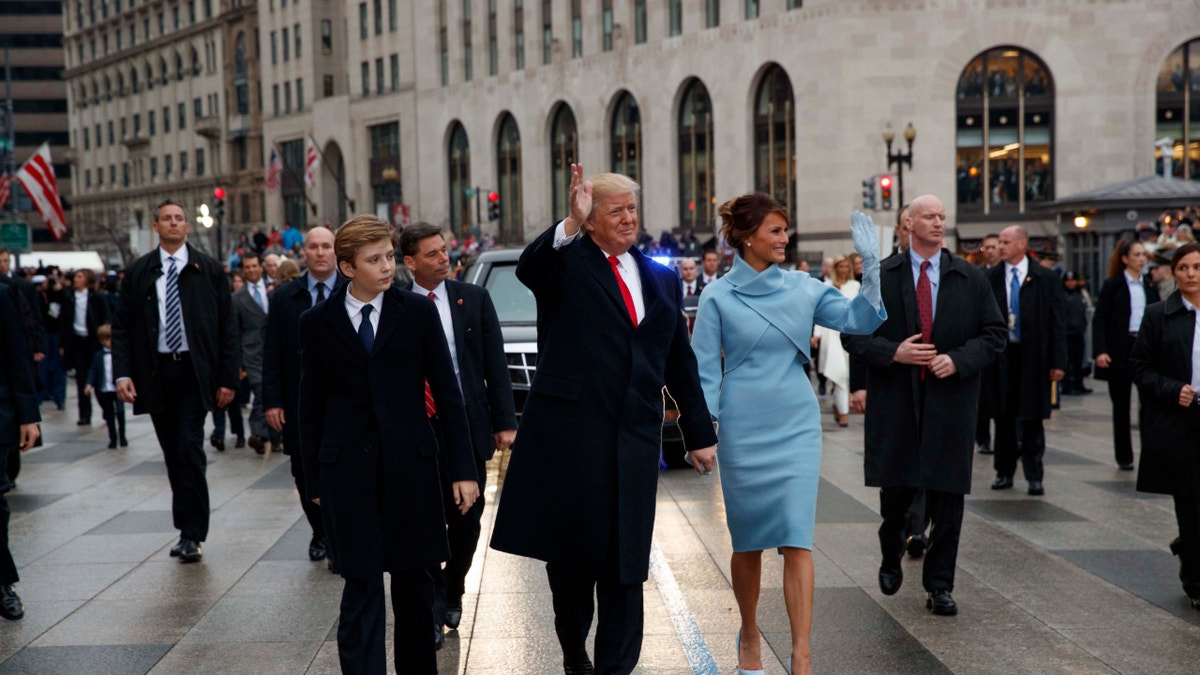 Donald and Melania Trump with Barron walking on Pennsylvania ave.