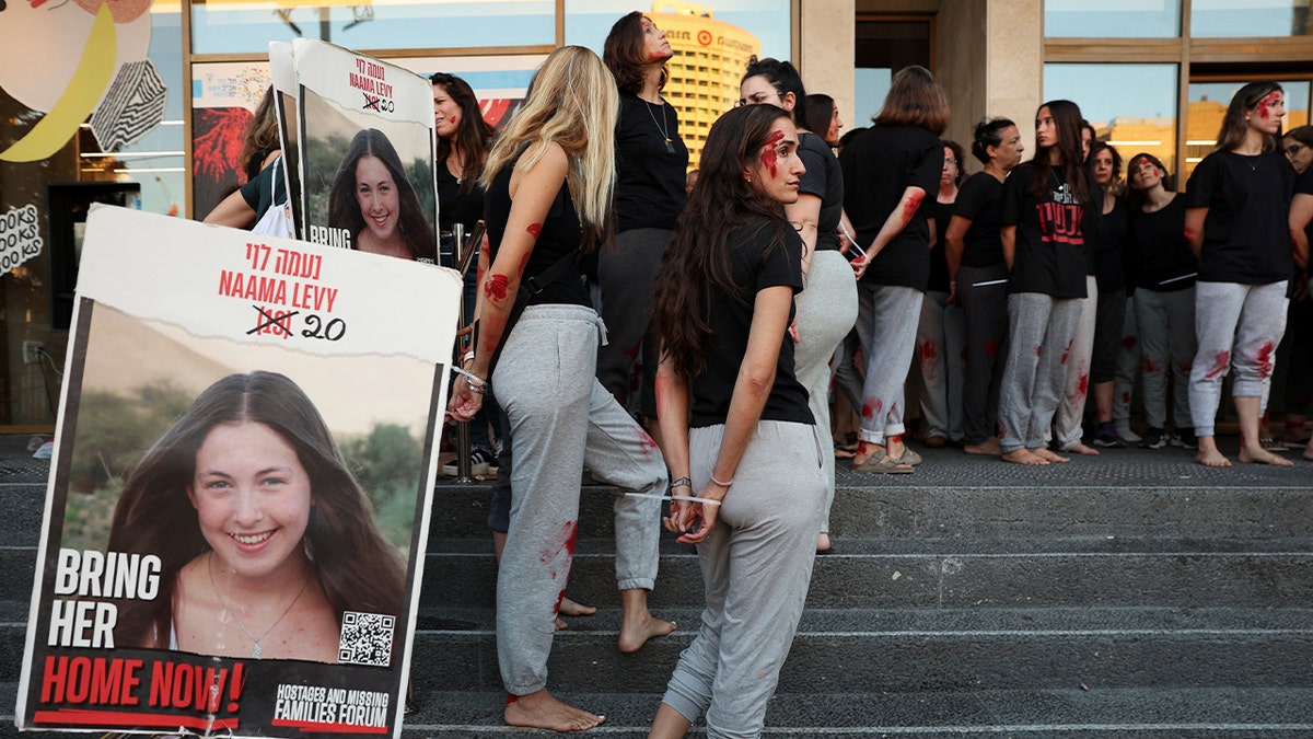 Protesters in Tel Aviv recreate the famous image of Naama Levy's kidnapping on Oct. 7, 2023