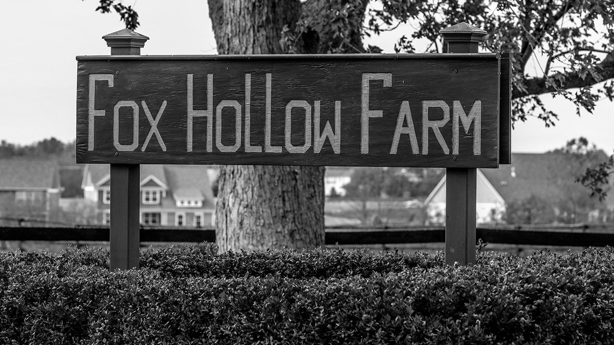 Black and white photo showing sign of Fox Hollow Farm