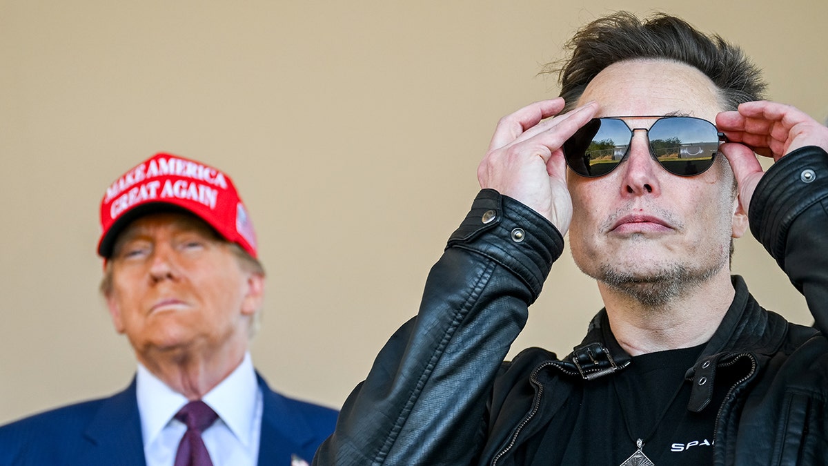 Donald Trump in red MAGA hat, Elon Musk with sunglasses