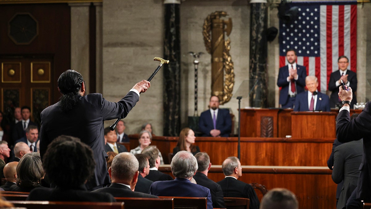 Rep. Al Green shaking cane at Trump during speech