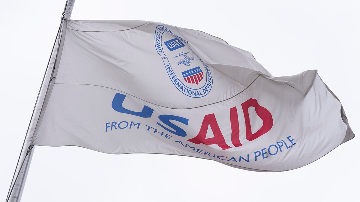 USAID flag flapping in wind