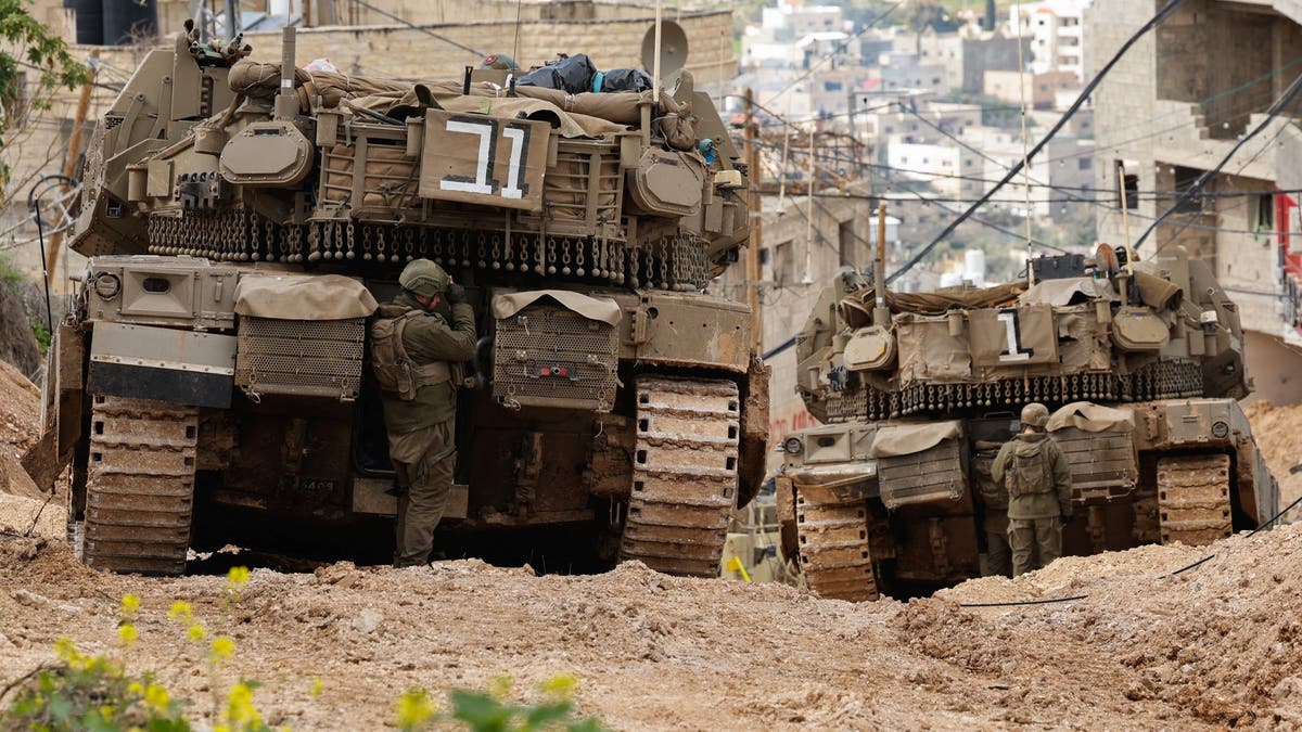 Israeli soldiers pictured near tanks in Gaza