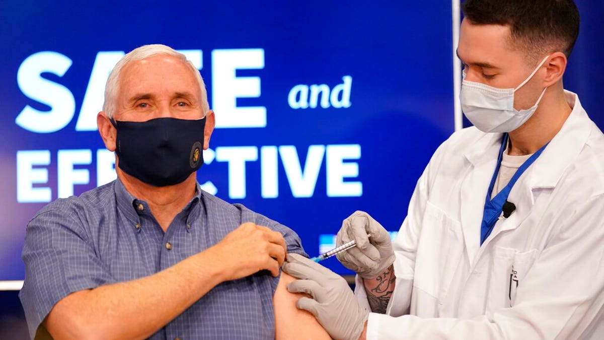 Then-Vice President Mike Pence receives a Pfizer-BioNTech COVID-19 vaccine shot at the Eisenhower Executive Office Building while still serving as vice president during President Donald Trump's first term in office.