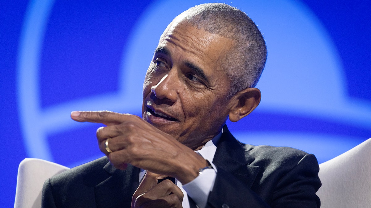 Former President Barack Obama pointing in closeup shot