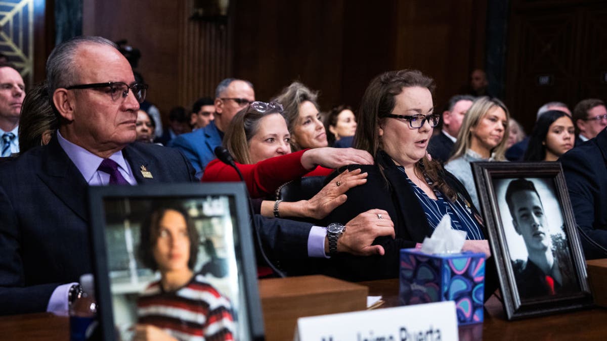 Bridgette Norring, right, whose son, Devin J. Norring, died in 2020 from a pill he thought was Percocet but was actually fentanyl, is comforted during the Senate Judiciary Committee hearing titled, "The Poisoning of America: Fentanyl, its Analogues, and the Need for Permanent Class Scheduling," in the Dirksen Building on Tuesday, Feb. 4, 2025. Jaime Puerta, president of Victims of Illicit Drugs, V.O.I.D., whose son Daniel died in 2020 from a fentanyl pill that he thought was OxyContin, appears at left.