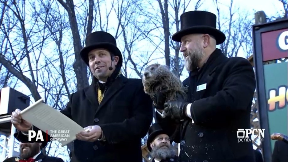 man holding groundhog