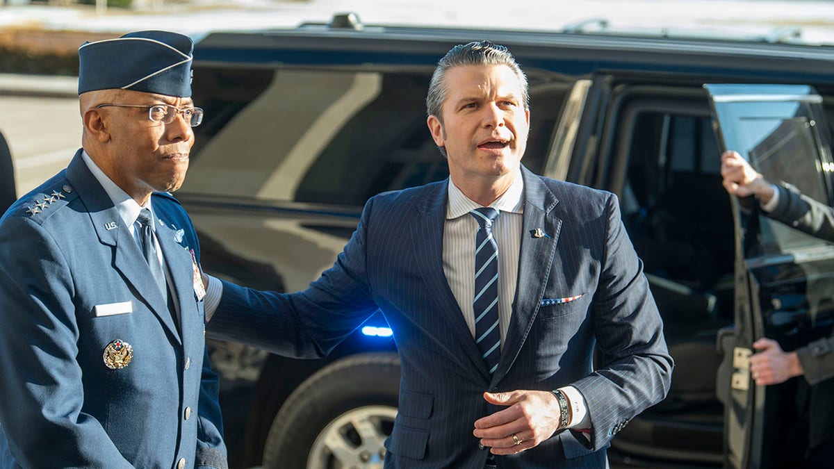 Hegseth outside the Pentagon with joint chief of staff