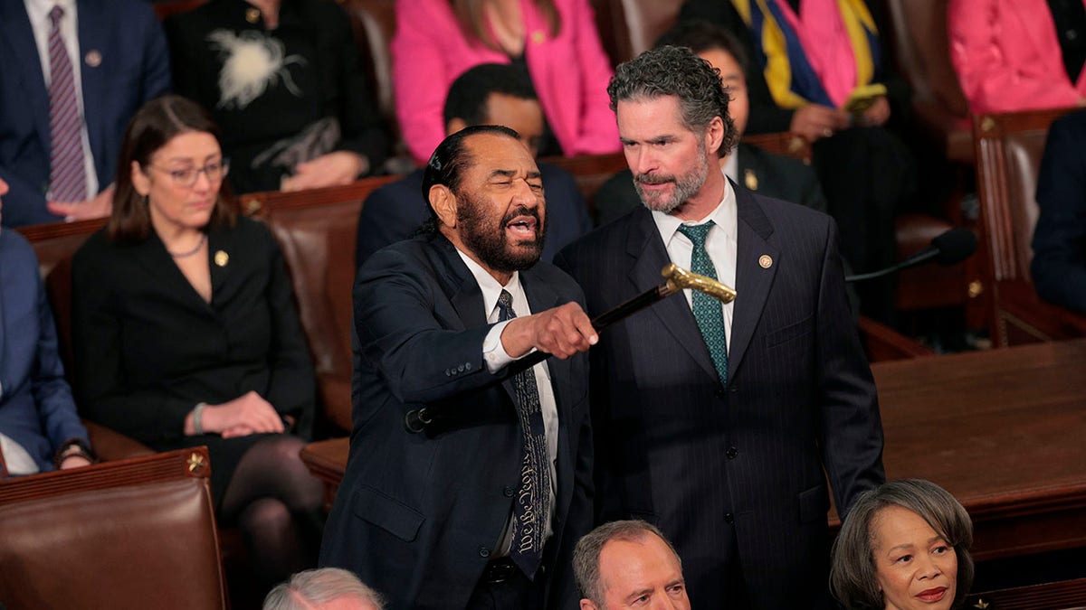 Al Green escorted out of congressional chambers after heckling Trump's address