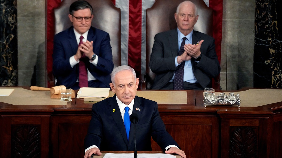 Netanyahu speaking to Congress; Rep. Johnson and Sen. Cardin behind him