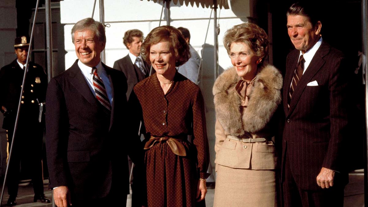 Jimmy Carter, Ronald Reagan, Nancy Reagan and Roslyn Carter stand outside the White House.