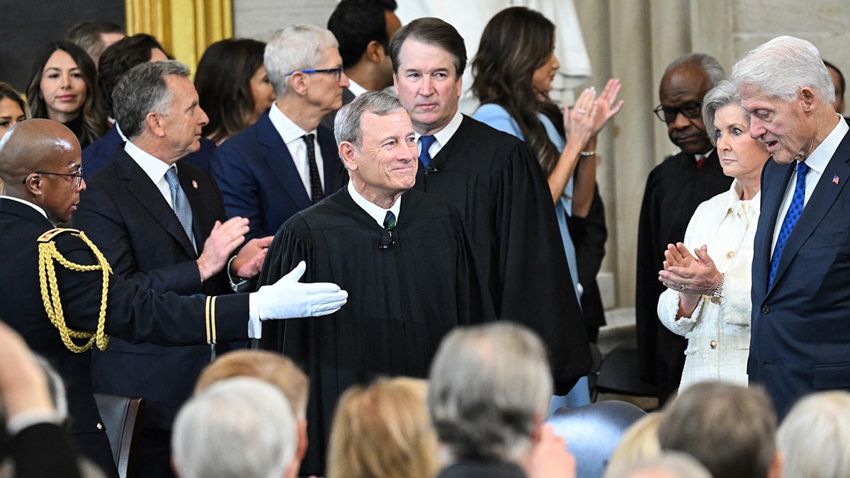 US Supreme Court Chief Justice John Roberts and Supreme Court Justice Brett Kavanaugh arrive for the inauguration ceremony