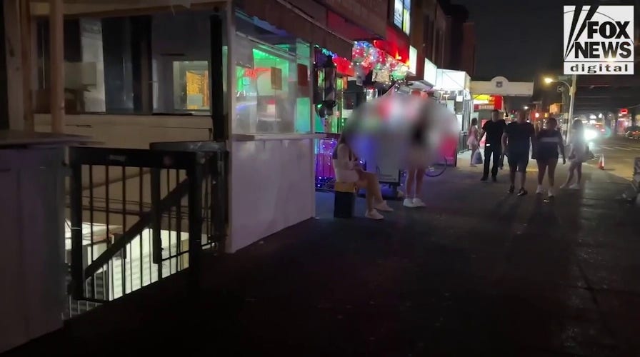 New York City street lined with prostitutes soliciting sex