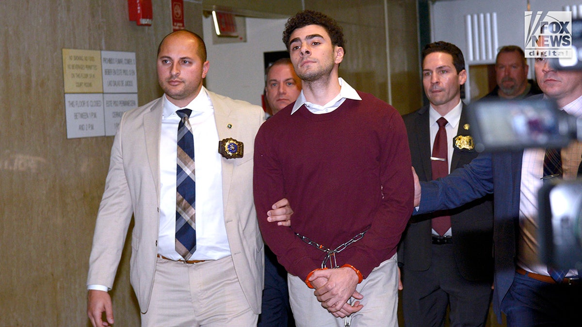 Luigi Mangione departs the courtroom following his arraignment