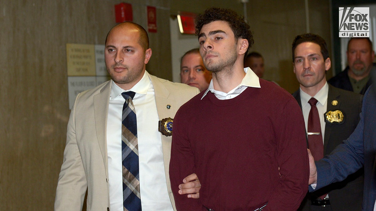 Luigi Mangione departs the courtroom following his arraignment