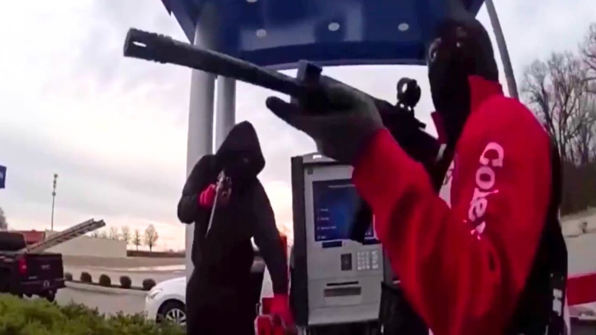 A group of brazen thieves were seen pointing assault rifles in the face of a cash-in-transit guard before making off with large sums of cash from an ATM machine, wild video released by police in Tennessee shows.