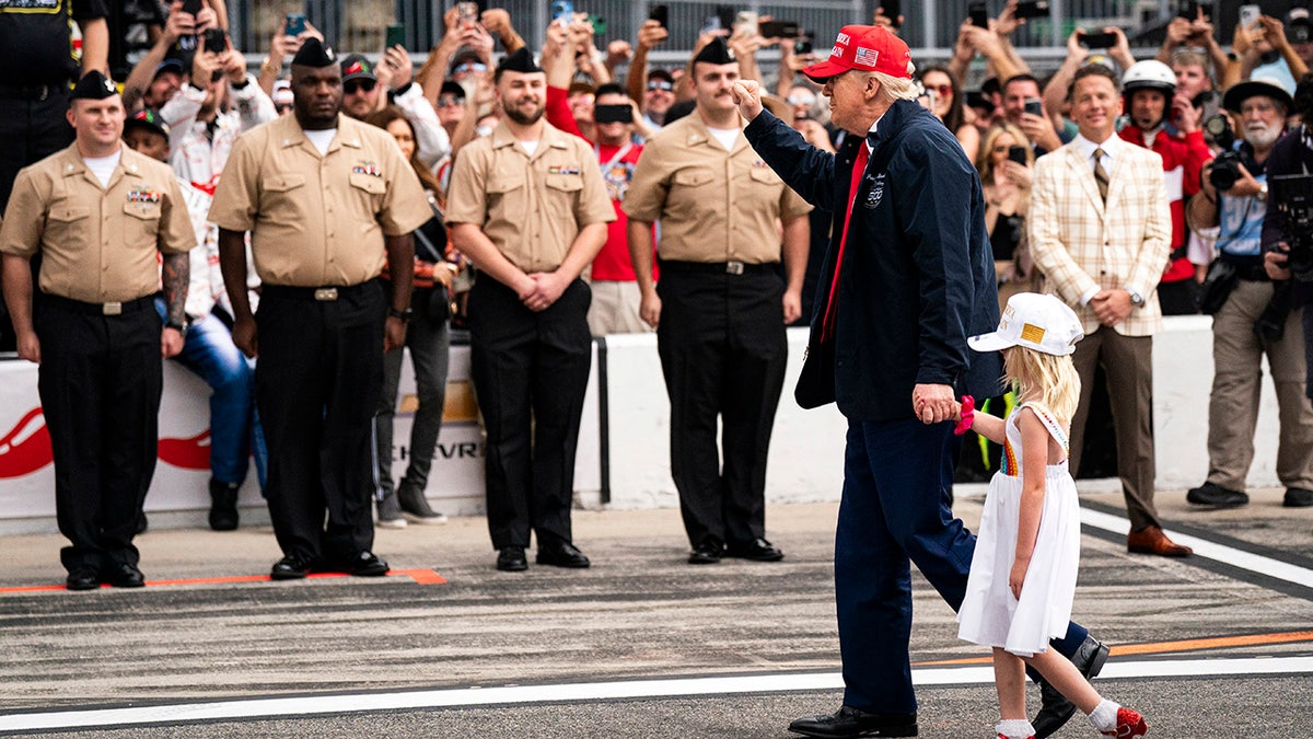 Donald Trump waves to supporters at the Daytona 500