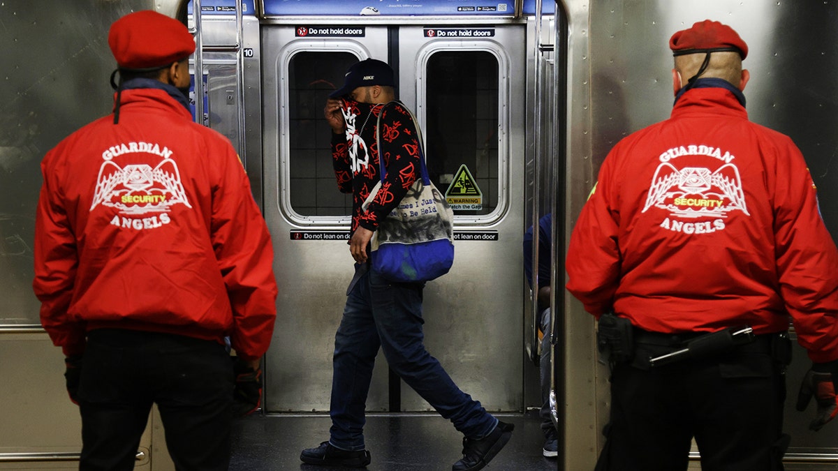 Guardian Angels at subway station 