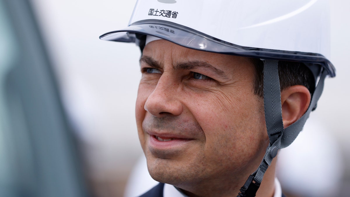 Pete Buttigieg, US transportation secretary, visits a shipping terminal at the Honmoku pier in Yokohama, Japan, on Monday, June 19, 2023. Buttigieg said the US must take steps to cut into Chinas advantage in batteries used to power electric vehicles, saying building the refining capacity for key materials is "addressable." Photographer: Kiyoshi Ota/Bloomberg