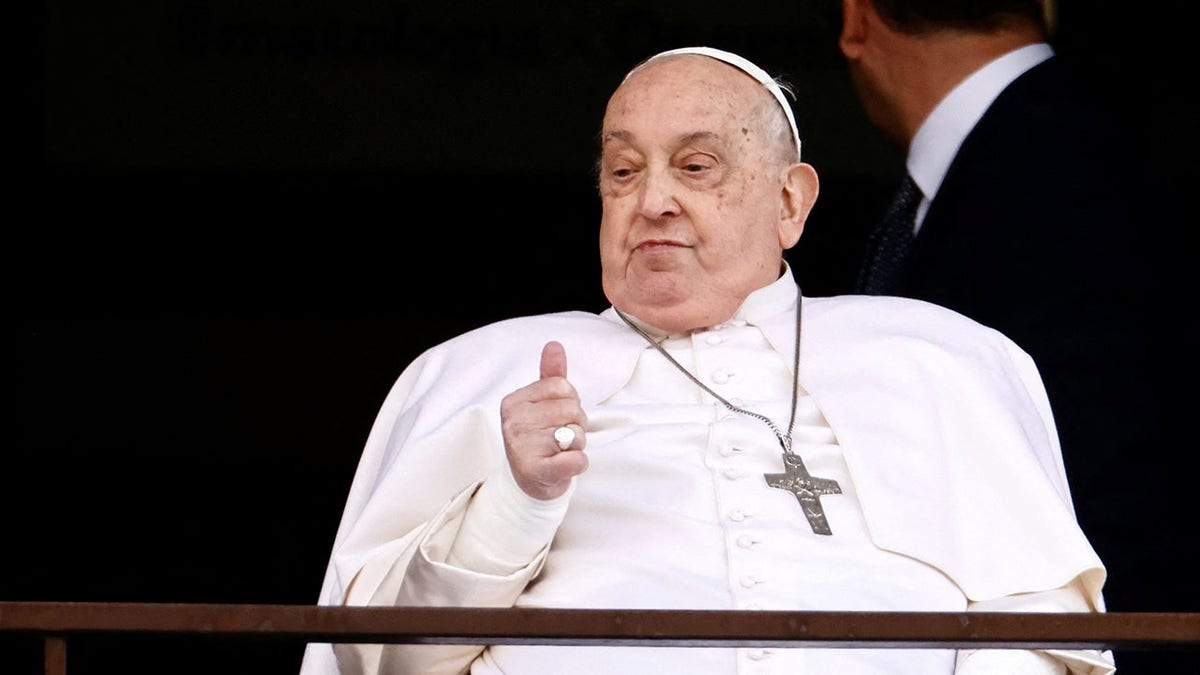 Pope Francis appears from hospital balcony