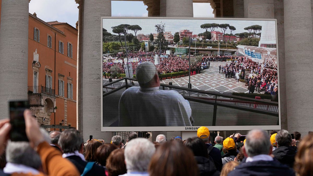 Pope Francis appearance broadcast in screen in St. Peter's Square