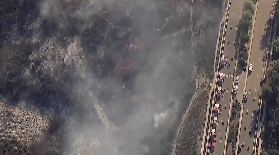 Brush fire threatening homes near San Diego 