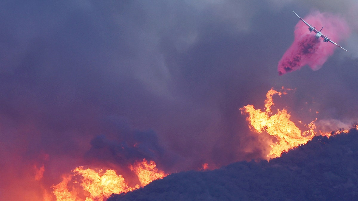 aircraft drops fire retardant